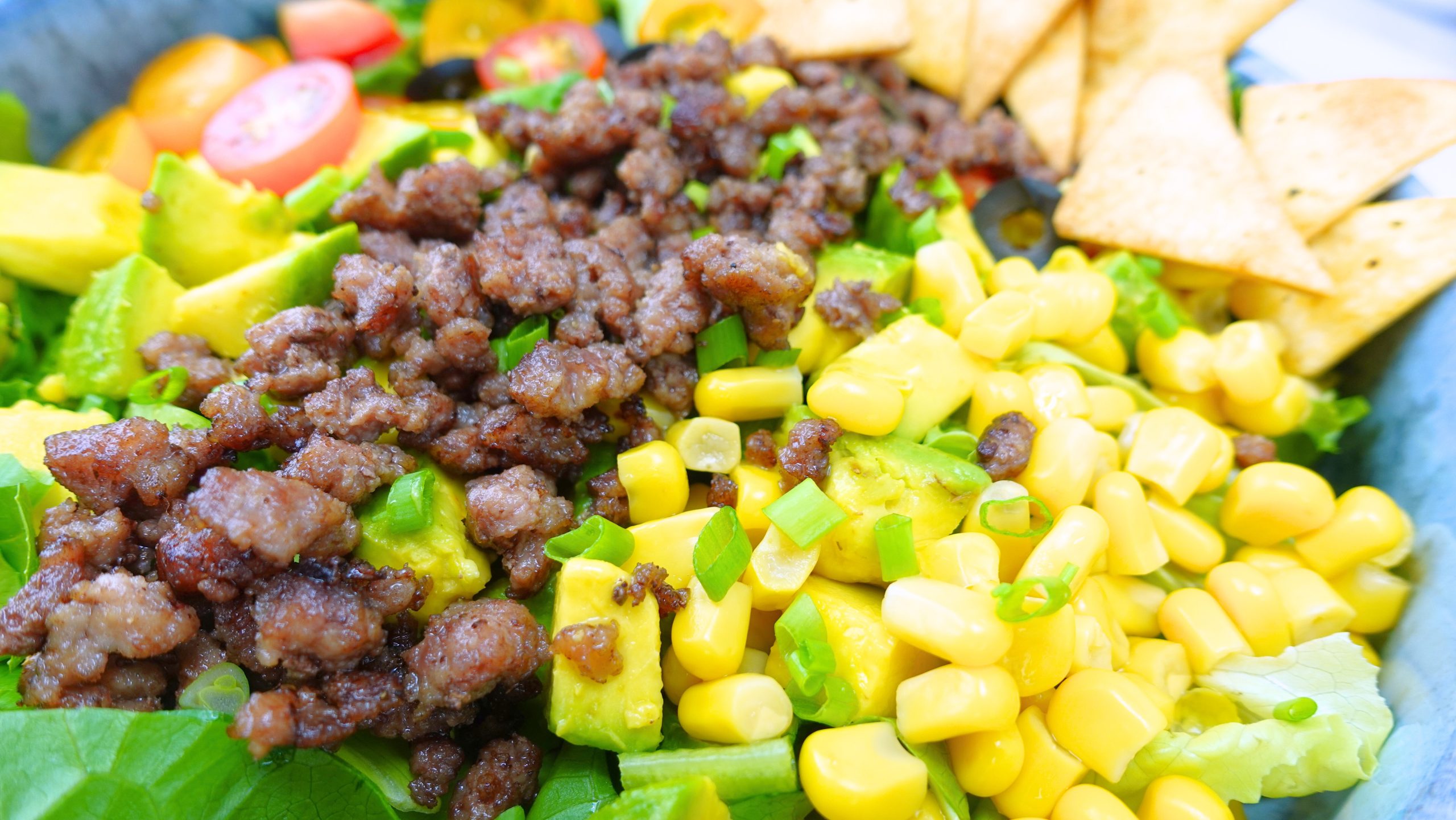 Close up of taco salad ingredients in a bow scaled