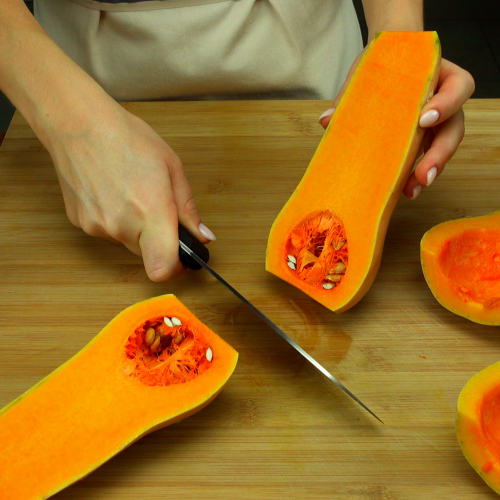 Cutting butternut squash into halves