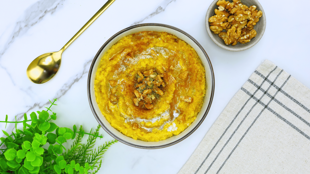 A bowl of healthy breakfast pumpkin pie quinoa garnished with cinnamon.