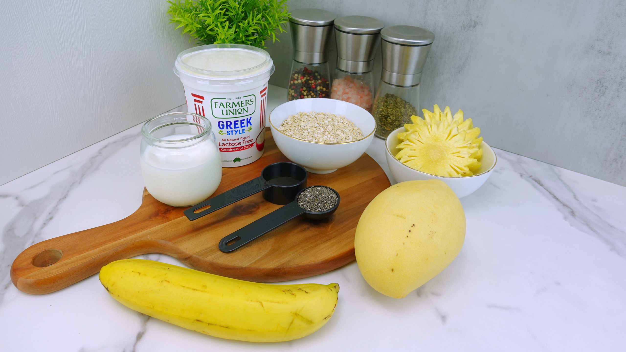 Ingredients for tropical overnight oats on a counter scaled