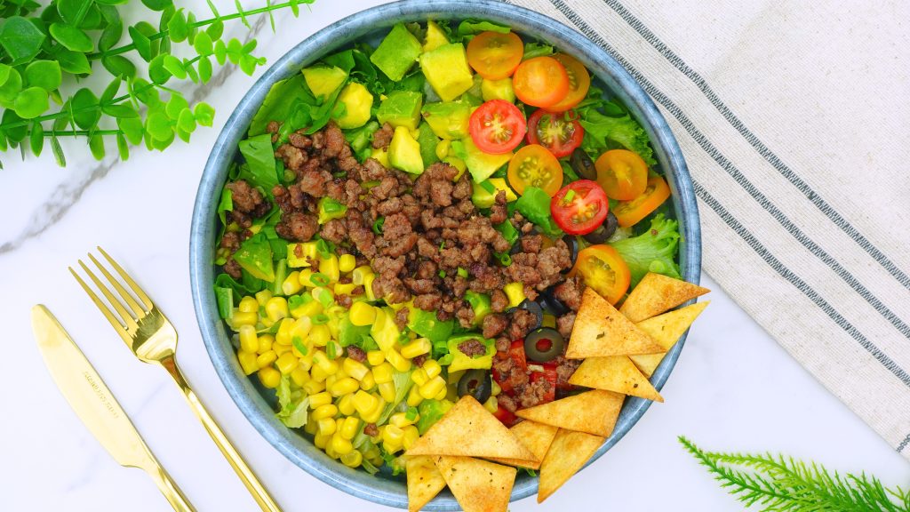 Plating taco salad with creamy cilantro dressing