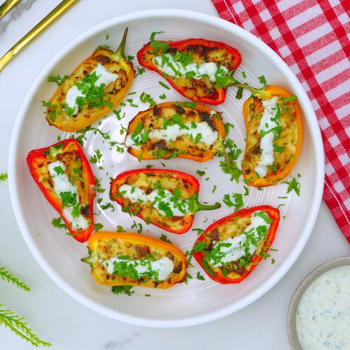 Close-up of smoky ranch chicken bites garnished with parsley.