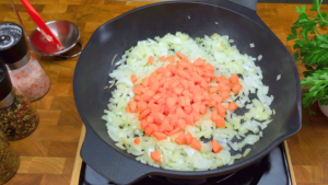 Sautéing vegetables in a pan