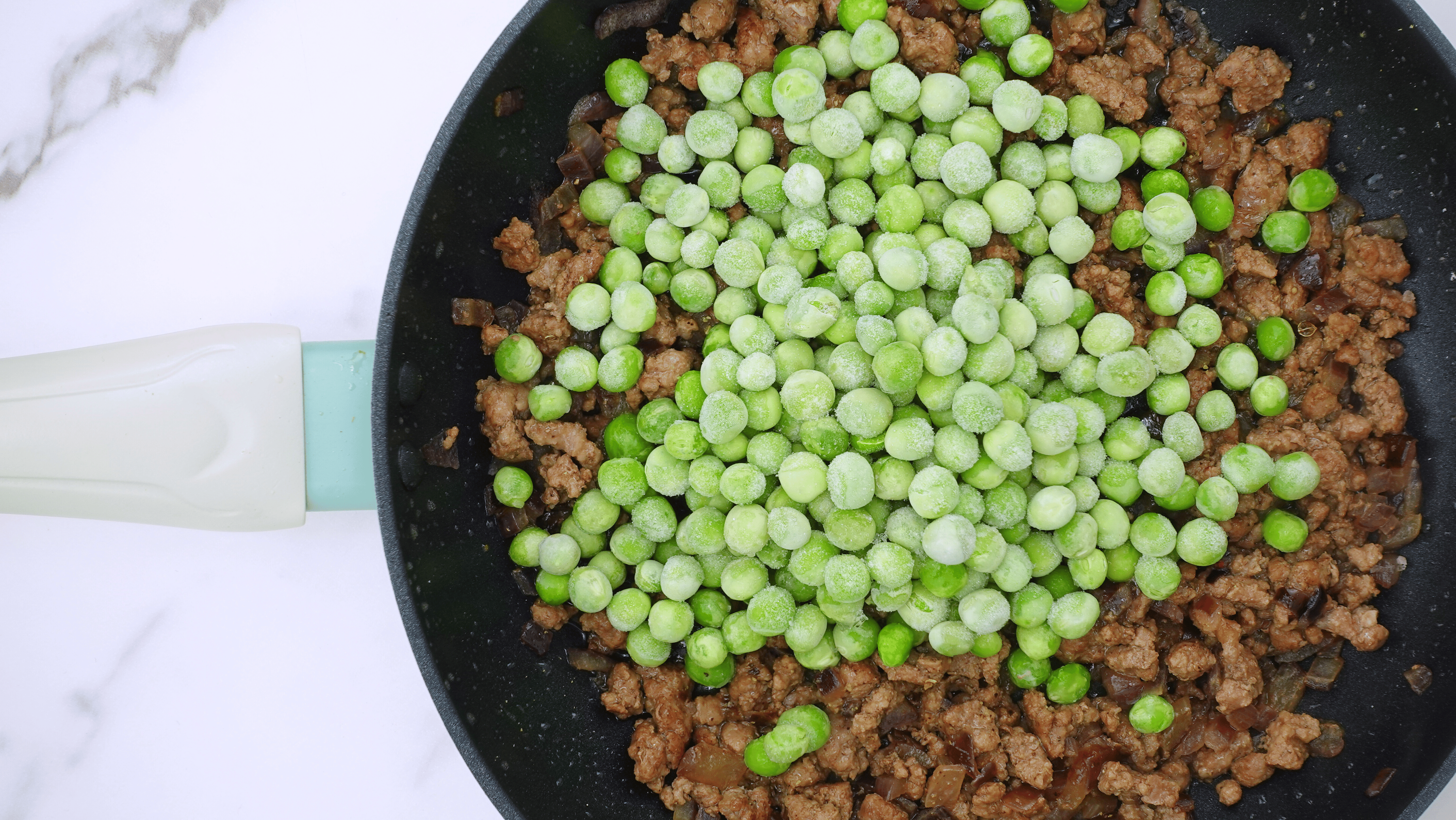 adding frozen peas to ground beef recipe