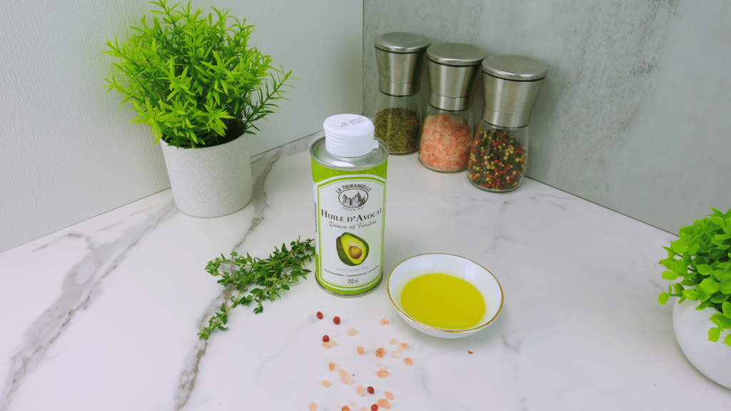 A bottle of avocado oil on a kitchen table.