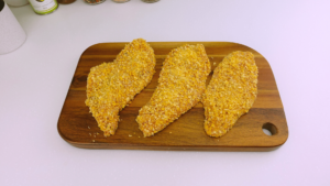 Chicken breasts coated in crushed cornflakes and panko breadcrumbs.