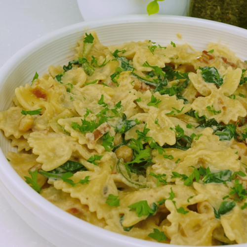 High-protein Marry Me Pasta ready to serve, topped with fresh basil and cashew sauce.