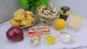 Ingredients for preparing garlic mushroom pasta.