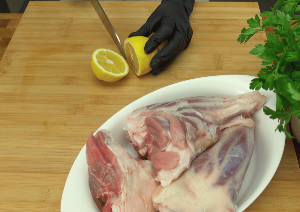 Raw lamb shanks with a medium layer of white fat for added flavor.