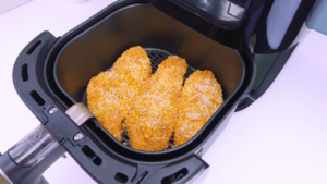 Chicken breasts breaded with Parmesan in an air fryer.