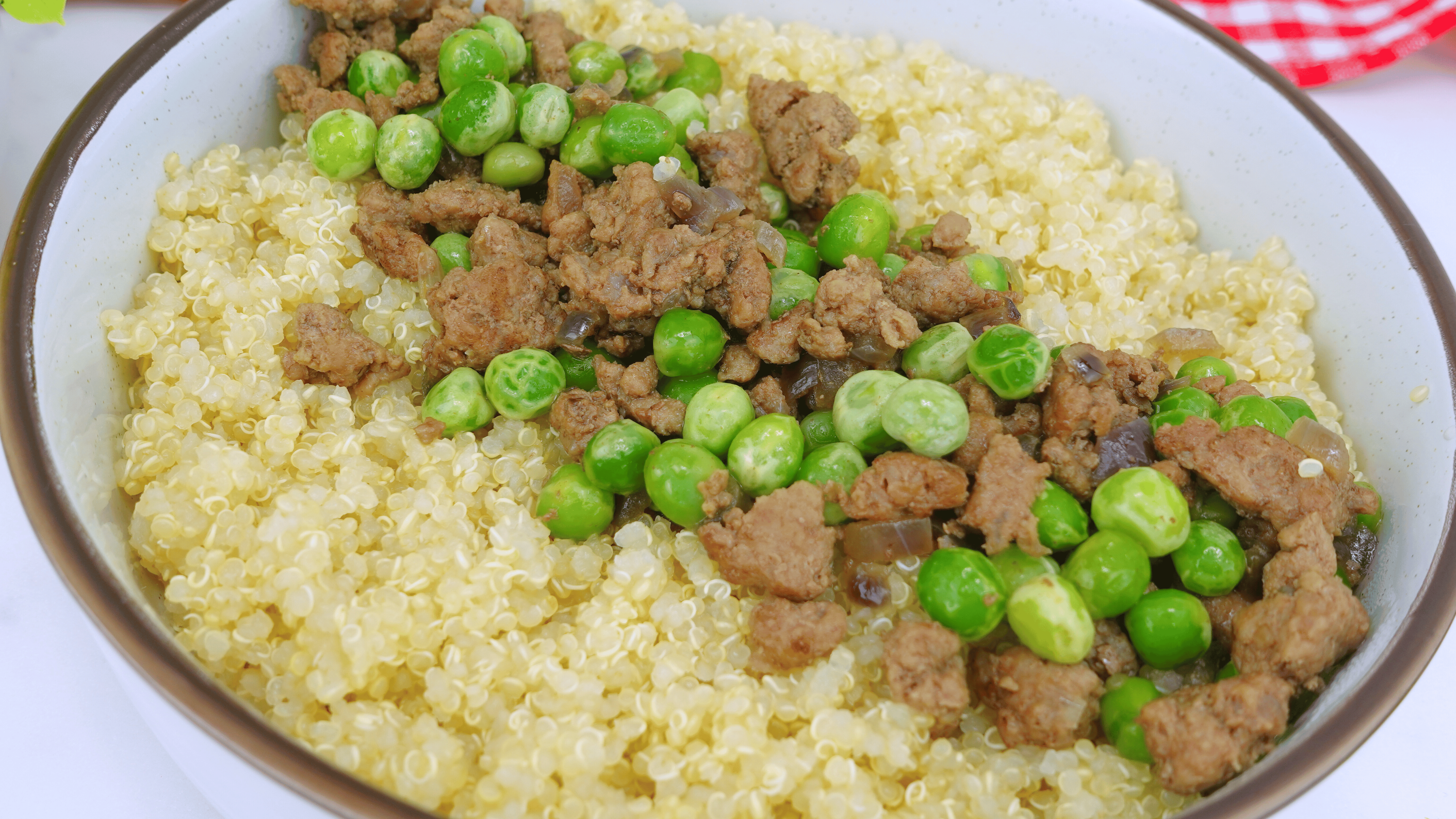 serving ground beef and peas over rice or potatoes