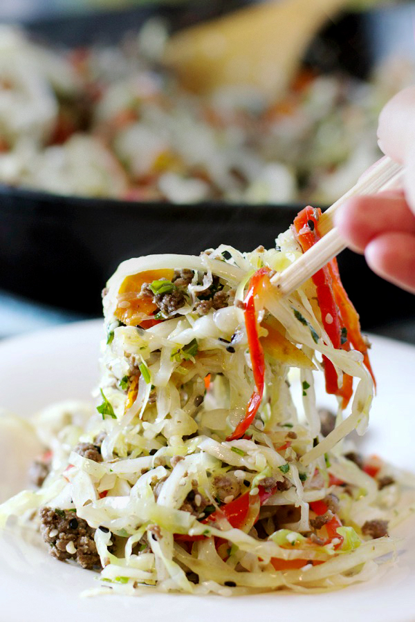 Asian Skillet Slaw In Bowl Eated by Chineese Chopsticks