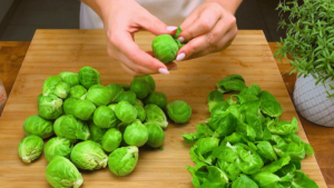 Cleaning fresh Brussels sprouts before cooking.