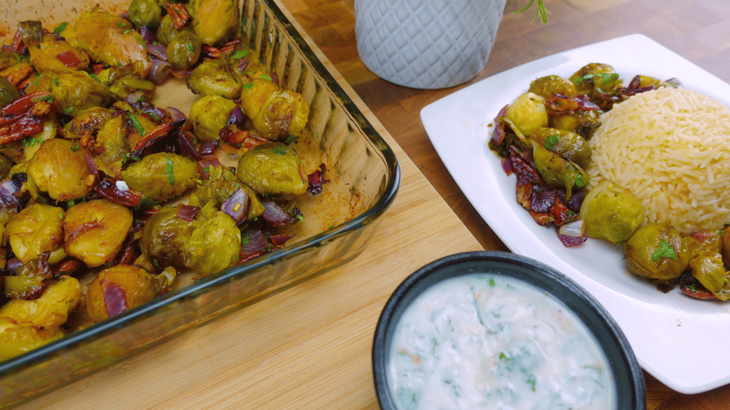 Serving Longhorn Brussels Sprout Recipe  and pecans with rice on a plate.