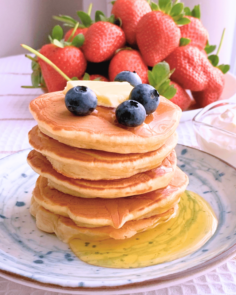 Cooking banana pancakes on a frying pan.